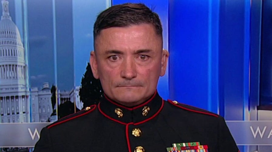 'The Saluting Marine' says gesture is an apology on 'behalf of the country'