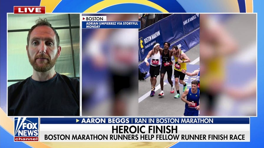 Boston Marathon runners help fellow competitor finish race