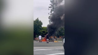California anti-ICE protester burns American flag