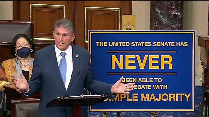 Manchin reiterates filibuster position during Biden press conference