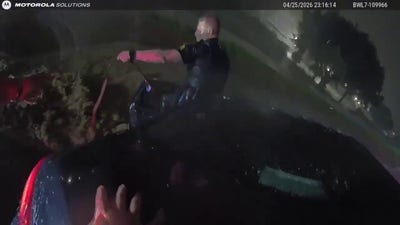 Video captures police pulling family from dangerous floodwaters
