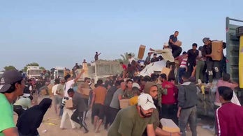 Footage shows Palestinians swarming aid convoy in Gaza