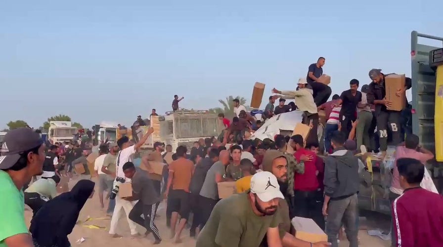 Footage shows Palestinians swarming aid convoy in Gaza