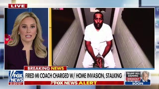 Fired Michigan coach charged with home invasion, stalking