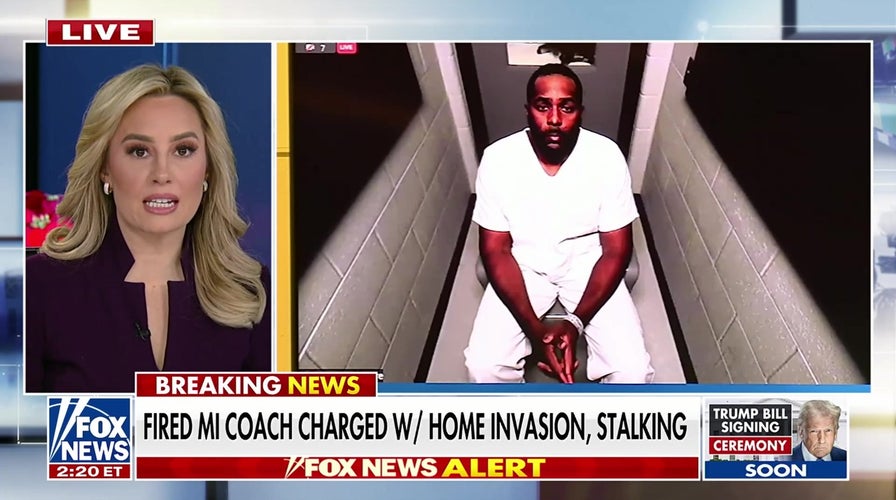 Fired Michigan coach charged with home invasion, stalking