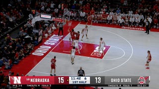 Braden Frager crosses up for a layup extending Nebraska's lead over Ohio State