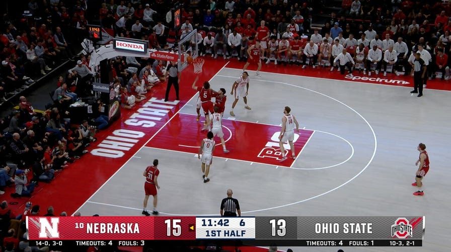 Braden Frager crosses up for a layup extending Nebraska's lead over Ohio State 