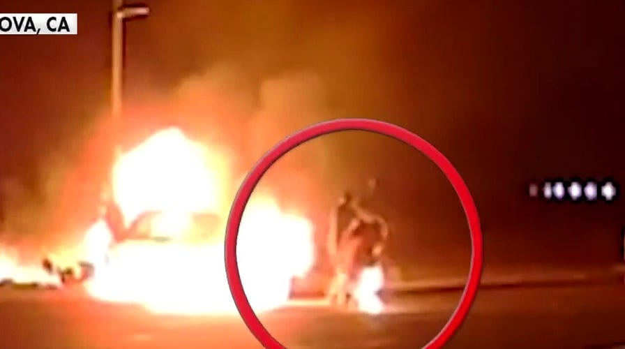 Off-duty officer saves two people from burning car