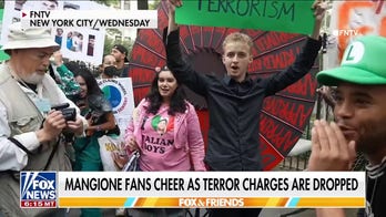 Crowd cheers after judge drops terror charges against Luigi Mangione 