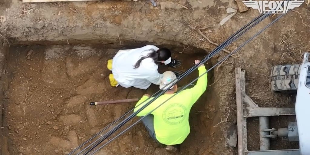 FBI agents dig up the yard at the home of Eugene Horsch