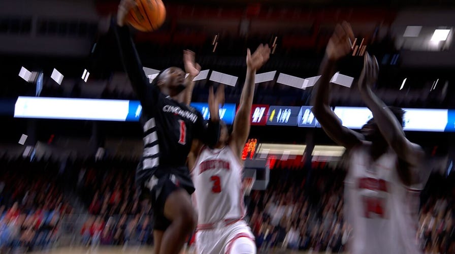 Day Day Thomas powerful drive towards the basket extends Cincinnati's lead over No. 8 Houston 