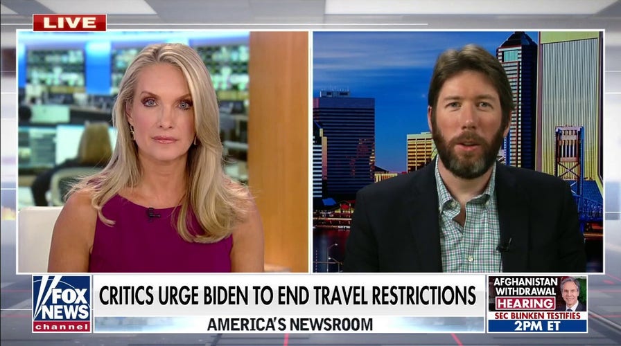 Critics urge Biden to end travel restrictions