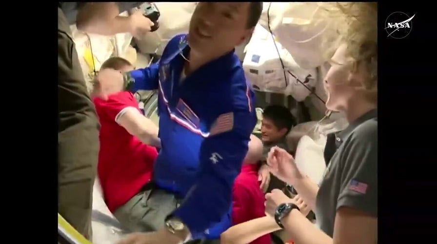 NASA astronaut Jonny Kim enters International Space Station after arriving on Russian spacecraft