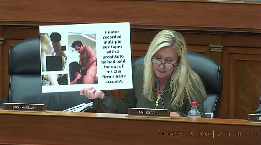 Rep. Marjorie Taylor Greene holds up censored photo of Hunter Biden and prostitute
