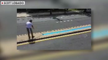 Black Lives Matter protester paints over Blue Lives Matter tribute