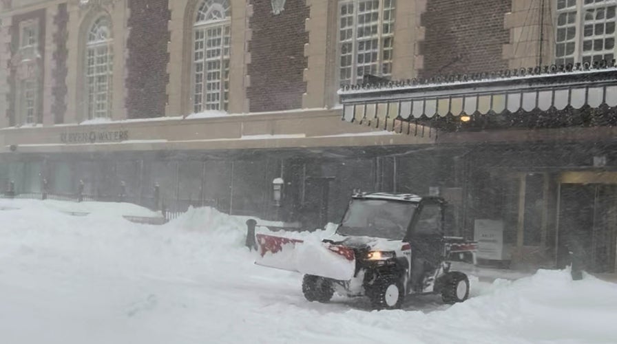  Lake-effect snowfall  pounds New England with hurricane-force gusts