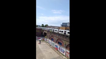 Passengers stuck on hot train receive gift from delivery driver