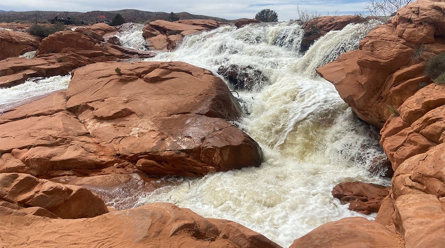 Rare desert waterfalls still flowing a month after record snowfall awakened them 