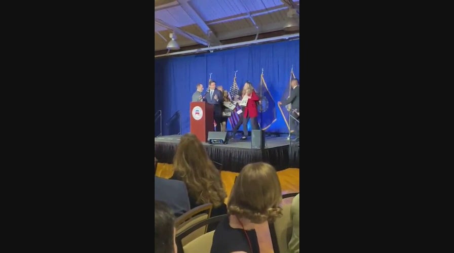DeSantis protesters rush stage during New Hampshire speech