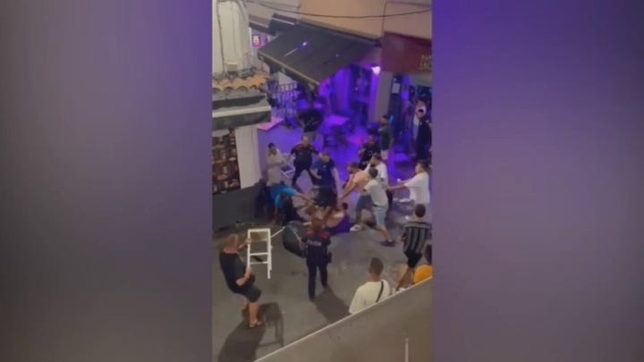 WARNING - GRAPHIC VIOLENCE: Brawl breaks out on Spain's 'Sin Street'