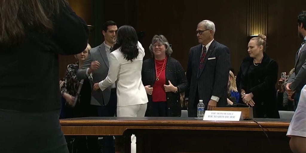 Tulsi Gabbard receives a round of applause upon the conclusion of her hearing