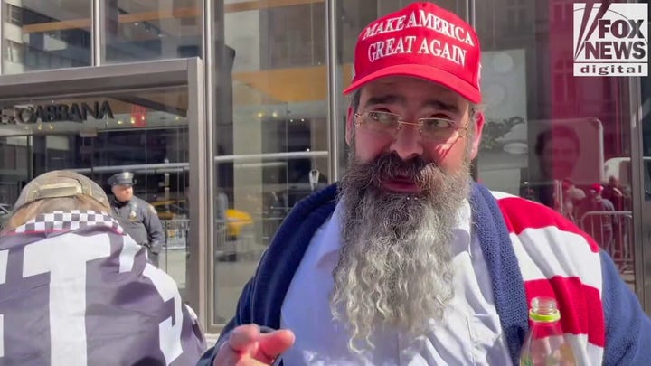 New Yorkers in front of Trump Tower clash over former president's