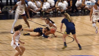 UConn's Sarah Strong gets the steal & flips it ahead to Ashlynn Shade for a layup vs. Michigan