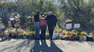 Guthrie family lays flowers outside Nancy Guthrie's home