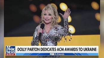 Dolly Parton says Ukraine is 'not political' but a 'humanitarian issue' after dedicating ACM awards