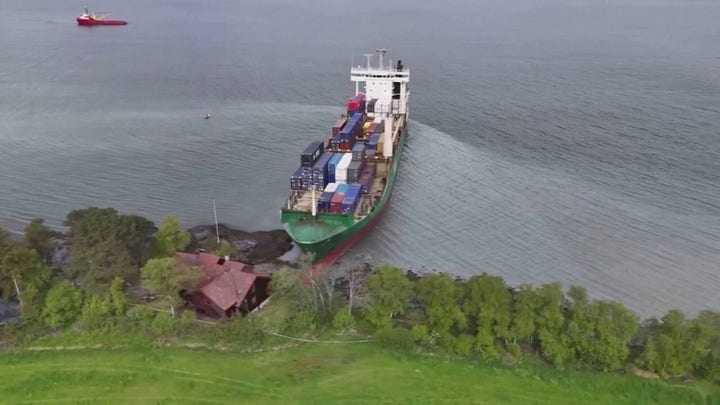 Man sleeps through giant container ship running aground in his yard