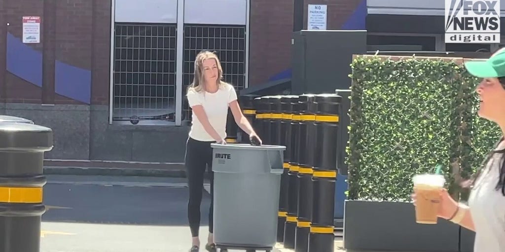 Karen Read takes out the trash behind Boston hotel