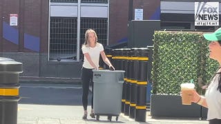 Karen Read takes out the trash behind Boston hotel
