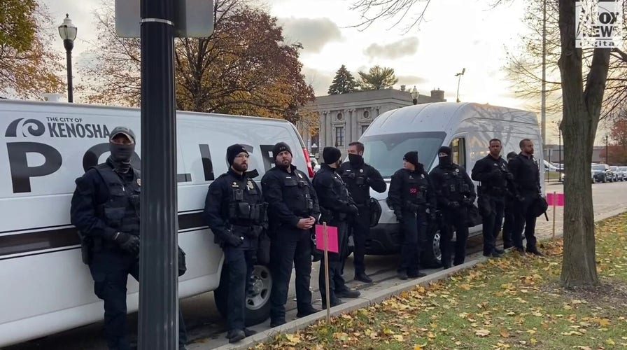 Kenosha Police stand by as demonstrators continue to protest outside courthouse