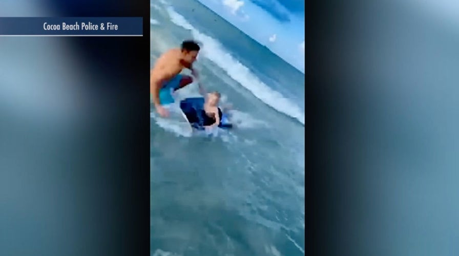 Raw video: Off-duty Florida officer pulls boy away from nearby shark