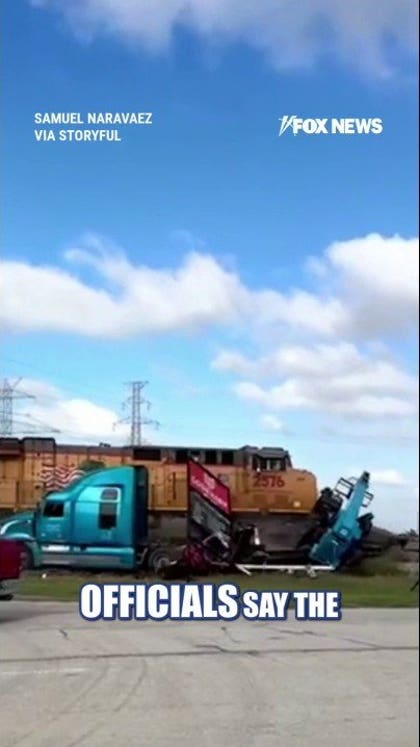 WATCH: Trucker NARROWLY escapes freight train CRASH