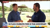Rick Reichmuth feeds elephants at Six Flags in honor of the park’s 50-year anniversary