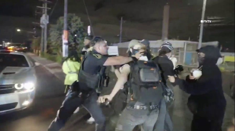 Protesters violently clash with New Jersey police outside Delaney Hall