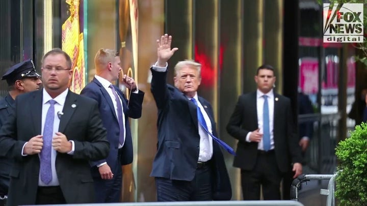 Donald Trump cheered and jeered as he arrives back at Trump Tower