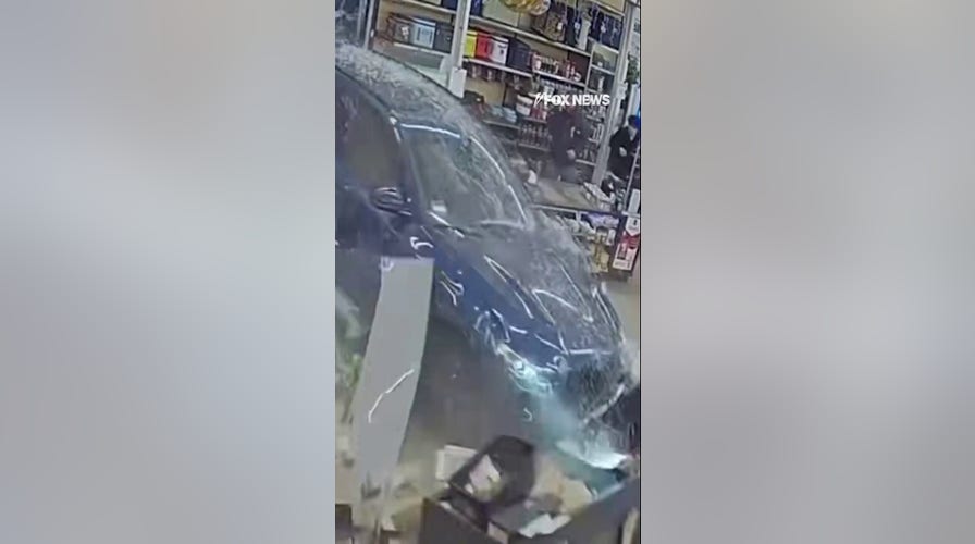 NEAR MISS: Vehicle crashes through the front of a hardware store
