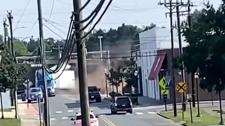 Train plows into semi-truck trailer in North Carolina town