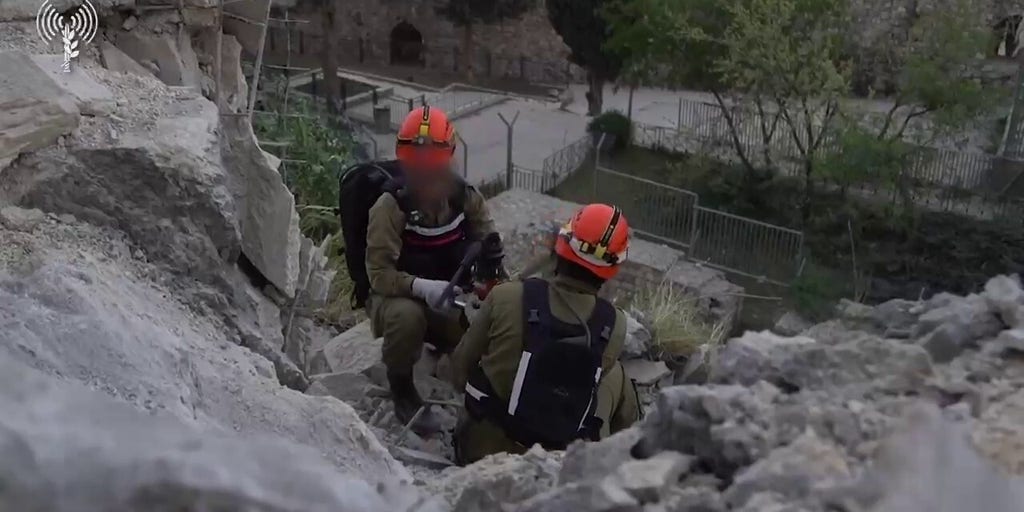 Crews clear debris site after missile fall in Jerusalem