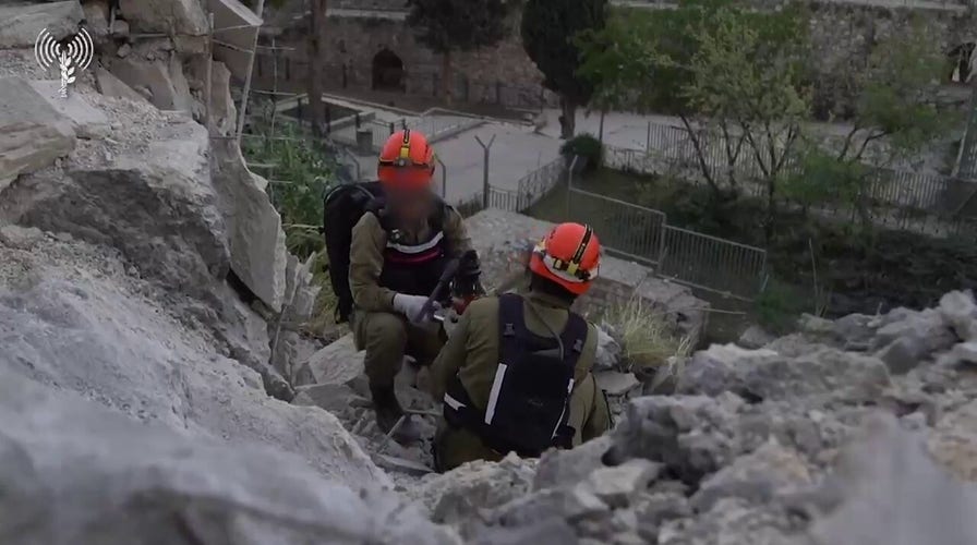 Crews wide   debris tract  aft  rocket  autumn  successful  Jerusalem