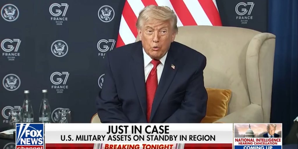 President Trump signs copy of Iran deal during dinner at Versailles