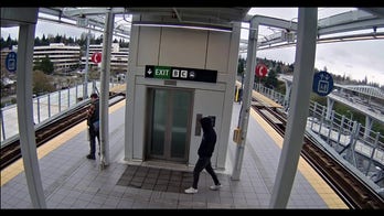 Video shows man try to push stranger into arriving train