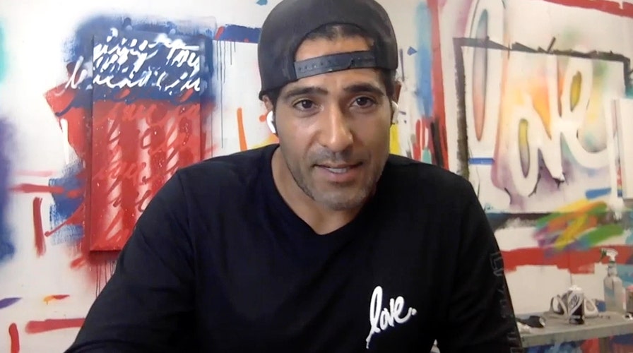 Financial adviser-turned-artist seeks to spread message of love