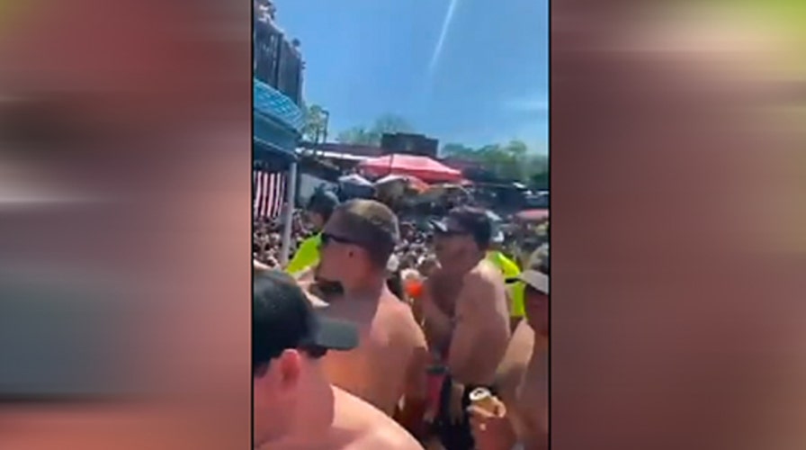 Crowds gather a bar in Osage Beach