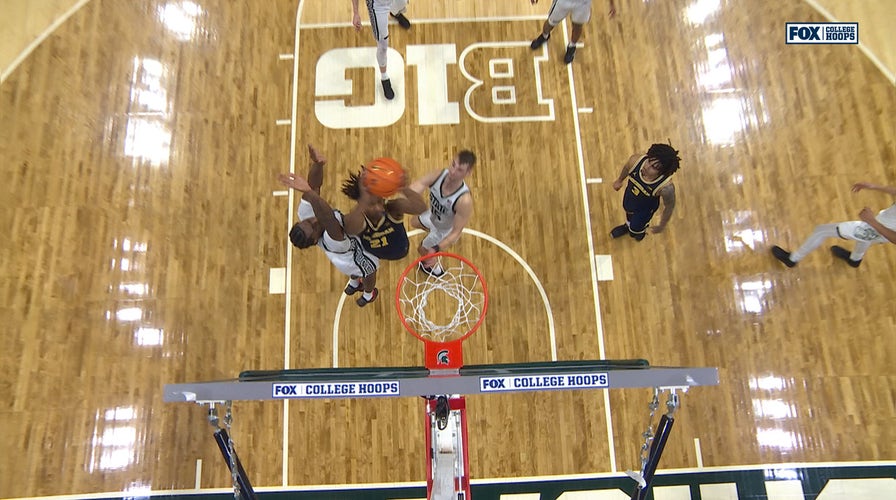 Michigan’s Elliot Cadeau feeds Morez Johnson Jr. for layup to seal win over Michigan State