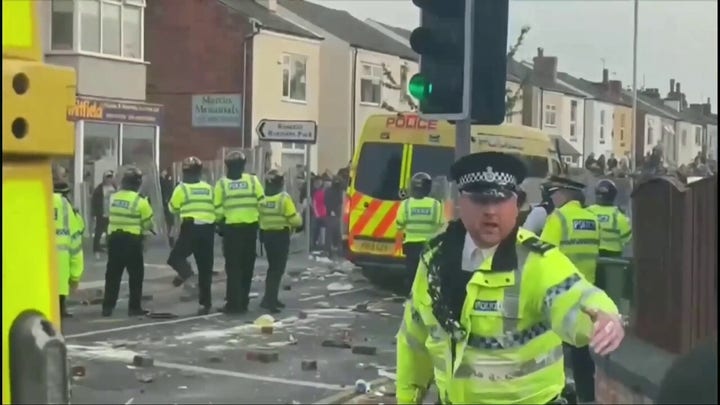 English town of Southport clashes with police after three girls killed in stabbing