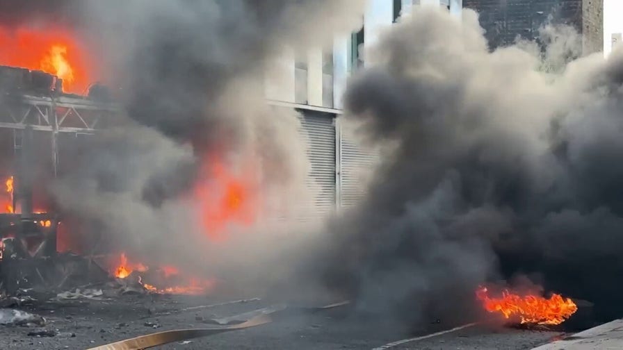 Bus torched as protest erupts after stabbing
