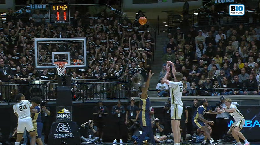Purdue's 7' 4" halfway Daniel Jacobsen splashes 3-pointer to widen pb implicit Akron